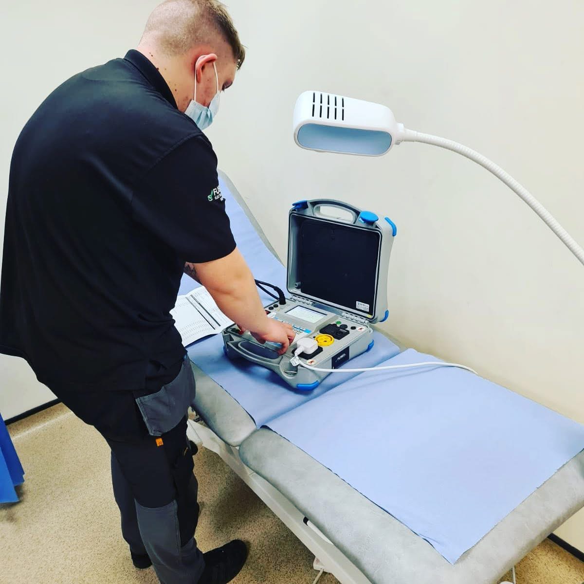 FUSED UK engineer carrying out PAT testing